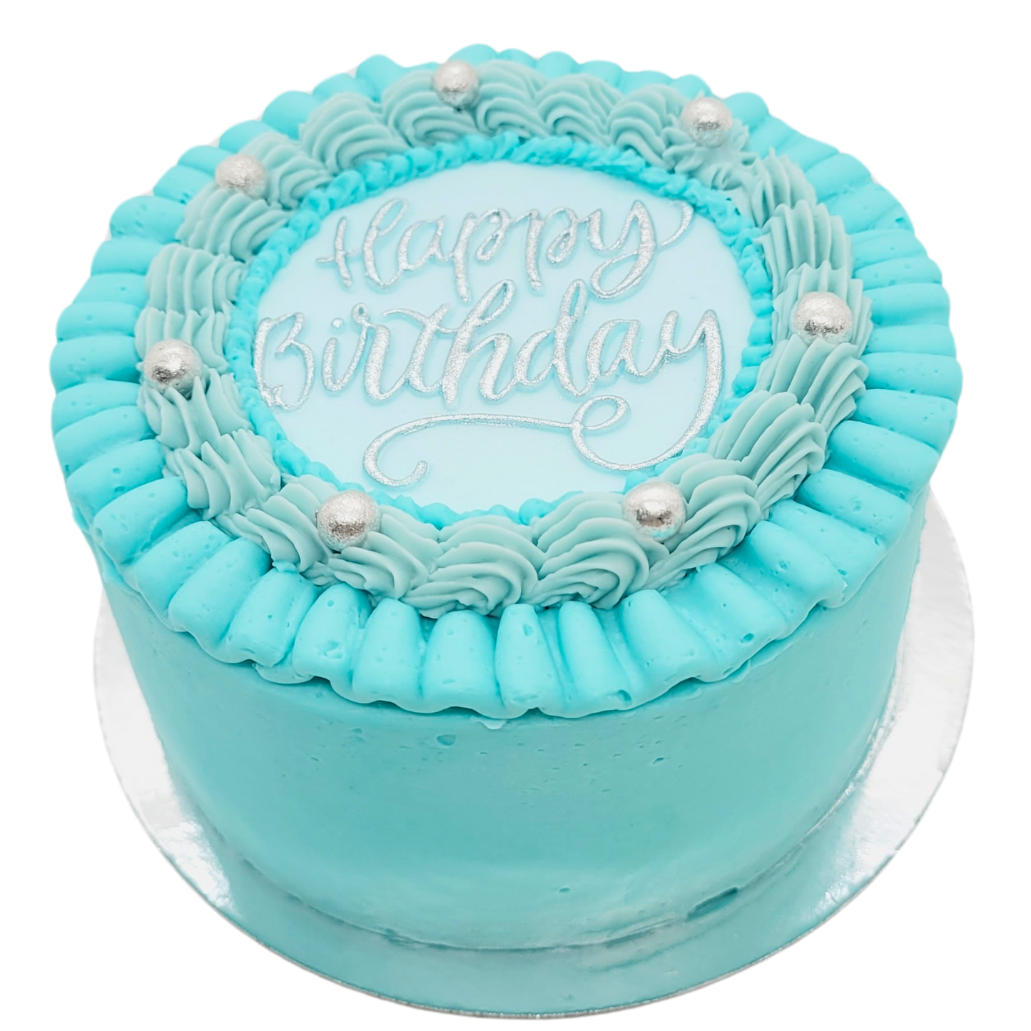 Mini cake in pastelblauw met zilveren “Happy Birthday” tekst en zilveren parels